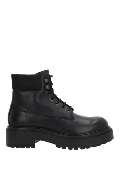 Prada Chunky Sole Metal Eyelets Round Toe Boots In Black