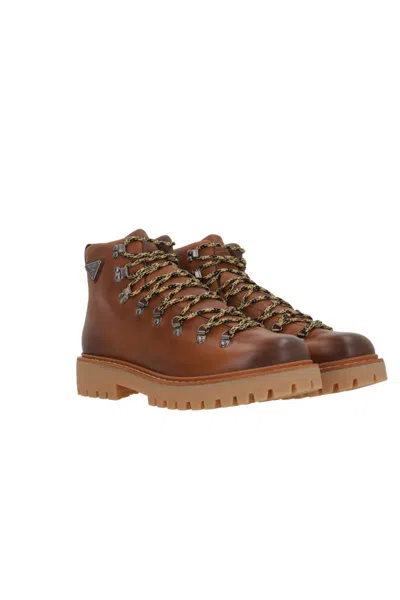 Prada Triangle-enamel Boots In Brown