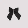 Prada Brass Hair Clip With Maxi Bow Design In Black
