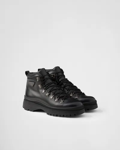 Prada Logo Plaque-detailing Boots In Black
