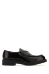 Prada Round Toe Shiny Finish Loafers In Brown