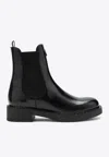 Prada Logo Plaque Brushed-effect Ankle Boots In Black