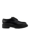 Prada Brushed Leather Derby Shoes In Black