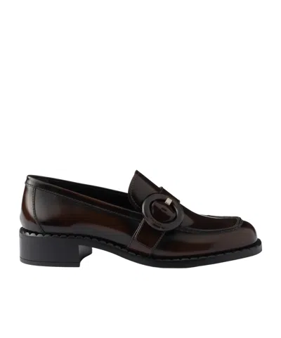 Prada Logo-engraved Buckle Loafers In Sienna