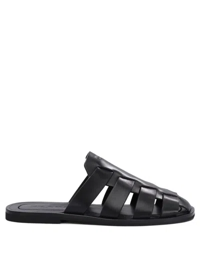 Prada Cage Mules In Black