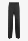 Prada Prince Of Wales Checked Wool Trousers In Gray