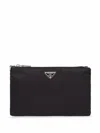 Prada Logo Plaque Zipped Wallet In Black