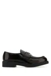 Prada Round Toe Shiny Finish Loafers In Brown