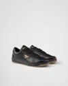 Prada Enamel-triangle Leather Sneakers In Schwarz