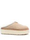 Prada Evolve Genuine Shearling Clog In Nude