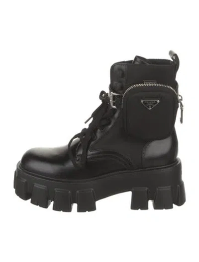 Pre-owned Prada Enameled Metal Triangle Leather Combat Boots In Black