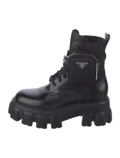Pre-owned Prada Enameled Metal Triangle Leather Combat Boots In Black