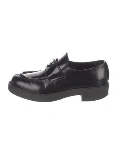 Pre-owned Prada Enameled Metal Triangle Leather Loafers In Black