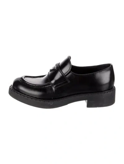 Pre-owned Prada Enameled Metal Triangle Leather Loafers In Black