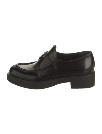Pre-owned Prada Enameled Metal Triangle Leather Loafers In Black