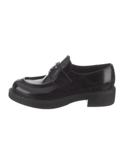 Pre-owned Prada Enameled Metal Triangle Leather Loafers In Black