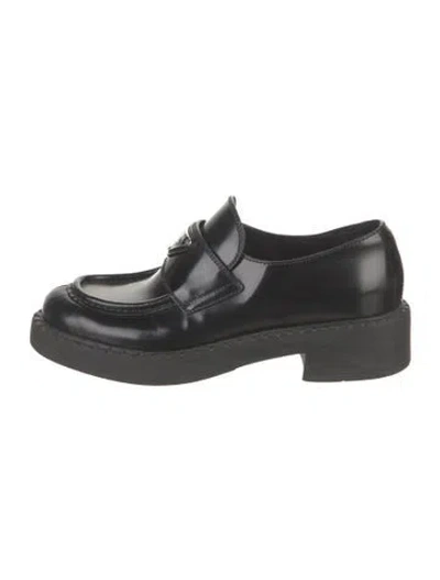 Pre-owned Prada Enameled Metal Triangle Leather Loafers In Black