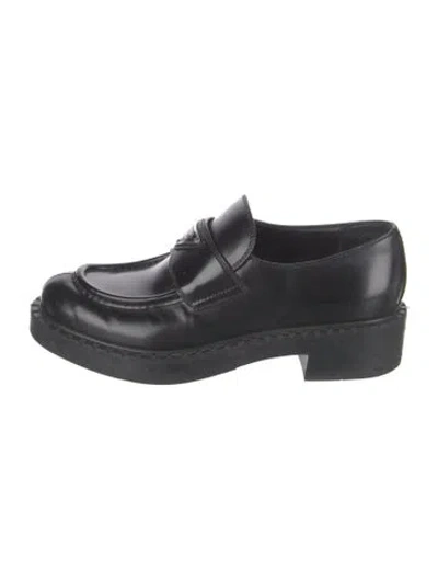 Pre-owned Prada Enameled Metal Triangle Leather Loafers In Black