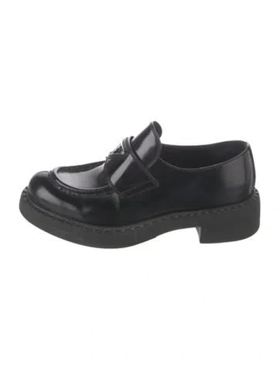 Pre-owned Prada Enameled Metal Triangle Leather Loafers In Black