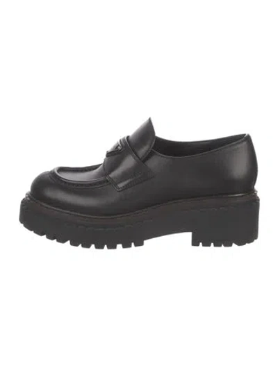 Pre-owned Prada Enameled Metal Triangle Leather Loafers In Black