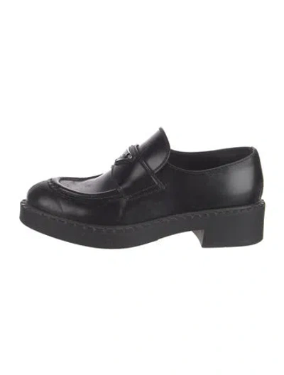 Pre-owned Prada Enameled Metal Triangle Leather Loafers In Black