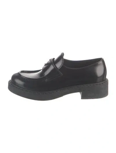 Pre-owned Prada Enameled Metal Triangle Leather Loafers In Black
