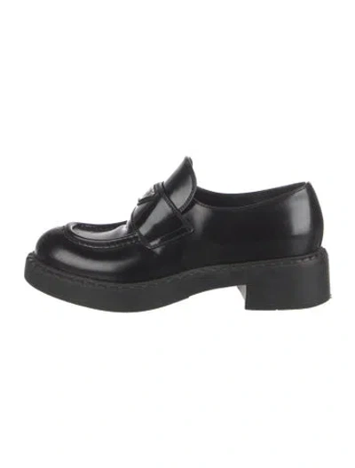 Pre-owned Prada Enameled Metal Triangle Leather Loafers In Black