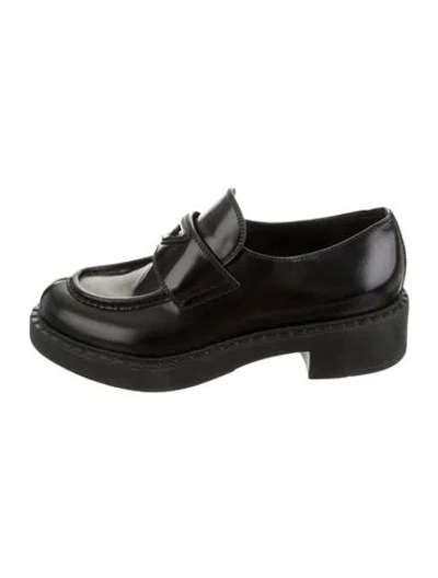 Pre-owned Prada Enameled Metal Triangle Leather Loafers In Black