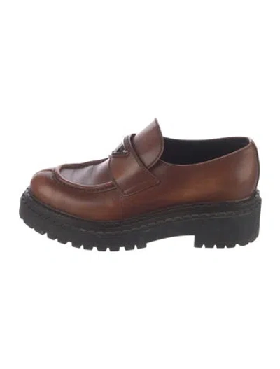 Pre-owned Prada Enameled Metal Triangle Leather Loafers In Brown