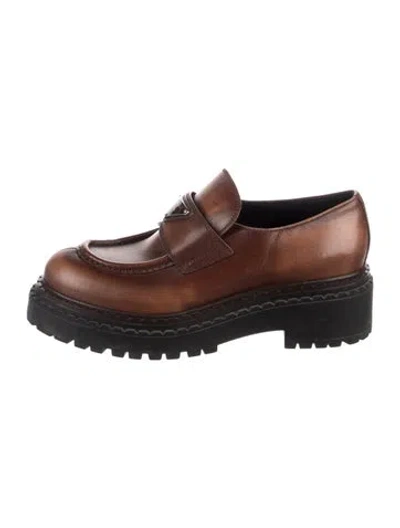 Pre-owned Prada Enameled Metal Triangle Leather Loafers In Brown