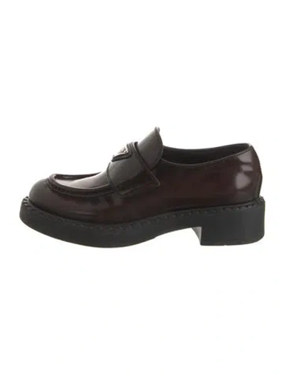 Pre-owned Prada Enameled Metal Triangle Leather Loafers In Brown