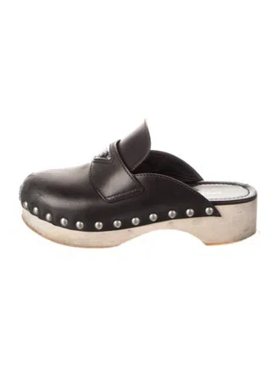 Pre-owned Prada Enameled Metal Triangle Leather Mules In Black