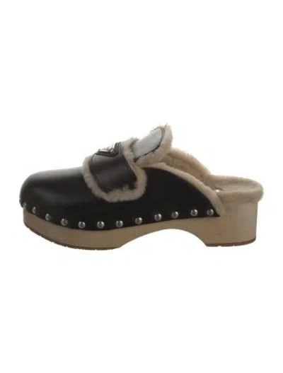 Pre-owned Prada Enameled Metal Triangle Leather Mules In Black