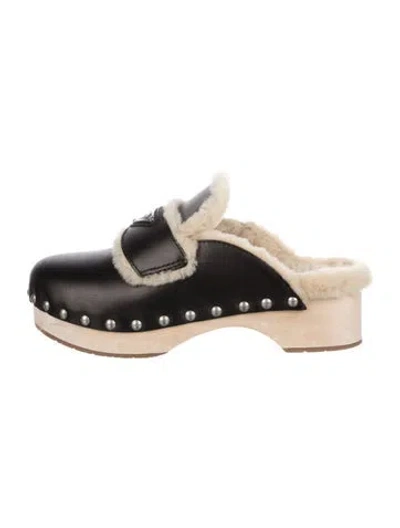Pre-owned Prada Enameled Metal Triangle Leather Mules In Black