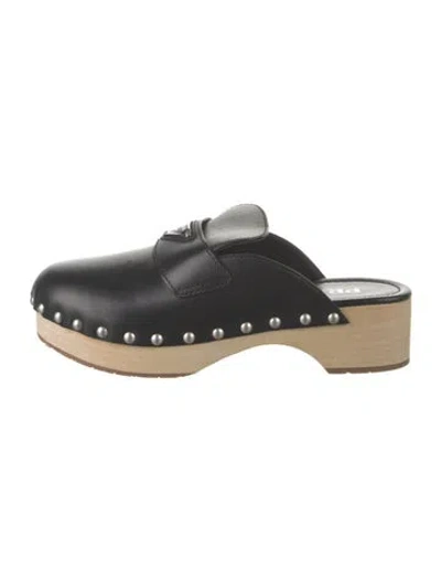 Pre-owned Prada Enameled Metal Triangle Leather Mules In Black