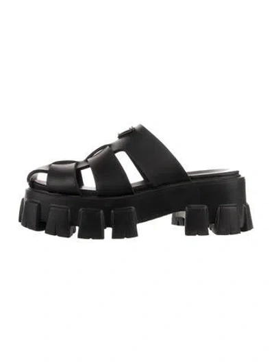 Pre-owned Prada Enameled Metal Triangle Leather Mules In Black