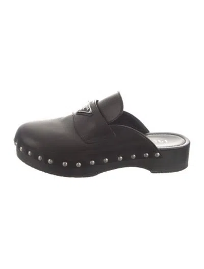 Pre-owned Prada Enameled Metal Triangle Leather Mules In Black