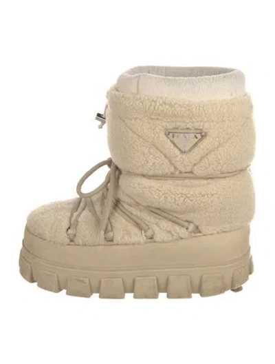 Pre-owned Prada Enameled Metal Triangle Shearling Lace-up Boots In Neutral