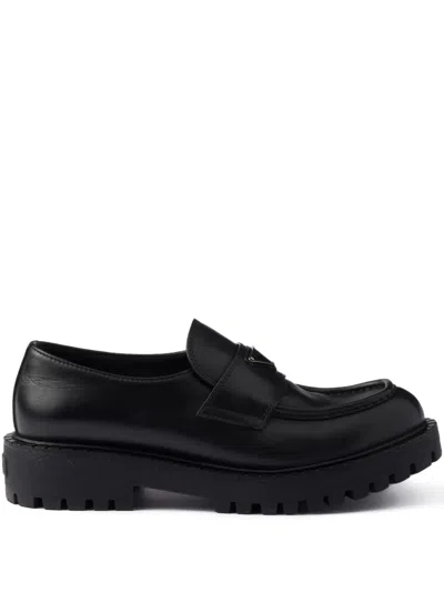 PRADA ENAMELLED-TRIANGLE LOGO LEATHER LOAFERS
