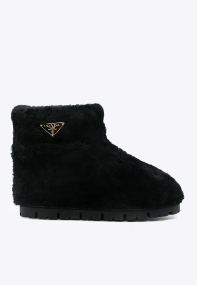 PRADA FAUX-SHEARLING SNOW BOOTS