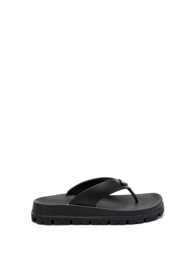 Prada Triangle-logo Flip Flops In Black