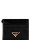 Prada Textured Black Wallet With Triangular Logo Emblem In Black