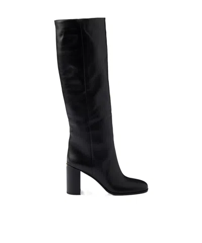 Prada Heeled Leather Boots In Black