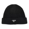 Prada L Beanie Hat With Triangle Logo In Black