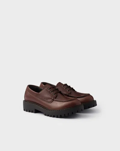 PRADA LACED LEATHER LOAFERS
