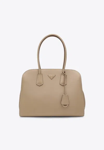 Prada Large Triangle Logo Leather Tote Bag In Sand