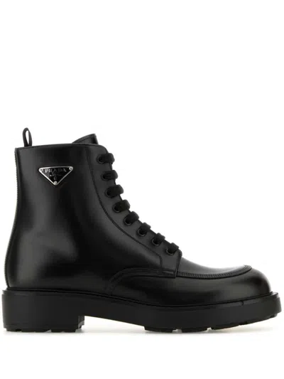 Prada Logo Plaque Leather Combat Boots In Black
