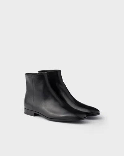 Prada 25mm Zipper Leather Booties In Black
