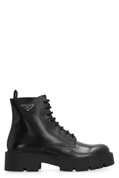 Prada Logo-plaque Panelled Ankle Boots In Black
