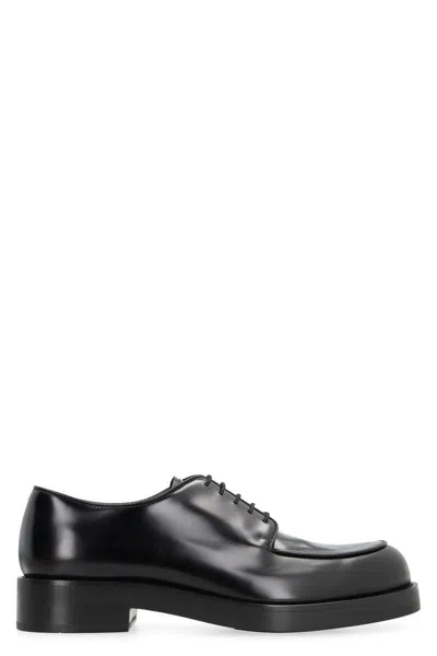 Prada Brushed Leather Derby Shoes In Schwarz